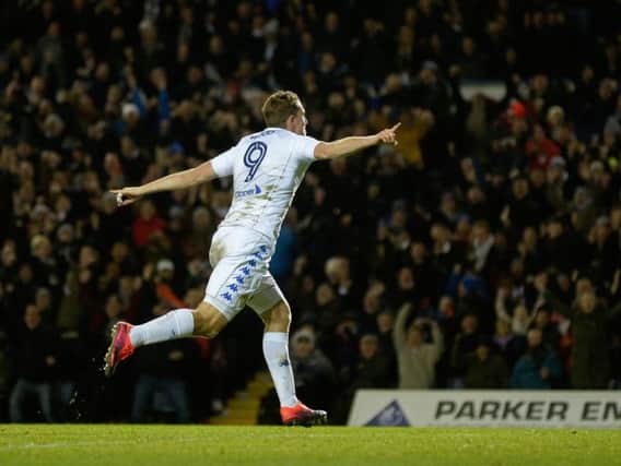 Chris Wood wheels away in celebration after putting Leeds 2-0 up