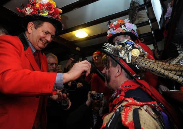 Lord of the Hood paints Fool Dale Smith's face ahead of the Haxey Hood, a tradition which is thought to be the oldest surviving in England.