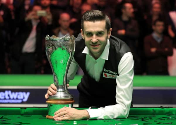 TOP MAN: Mark Selby celebrates with the UK Championship trophy after victory over Ronnie O'Sullivan. Picture: Mike Egerton/PA.