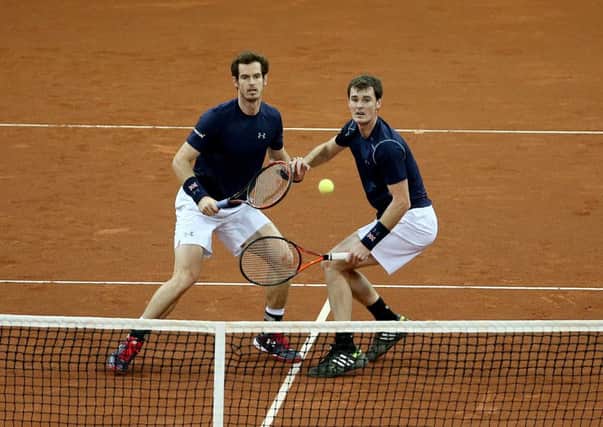 top men: Andy Murray (left) and brother Jamie in Davis Cup action. Picture: Andrew Milligan/P