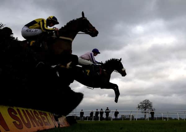 Cabragh, right, ridden by Jonathan England, on its way to winning the Stella Artois supports Bangor-on-Dee Maiden Hurdle at Bangor yesterday (Picture: Martin Rickett/PA Wire).
