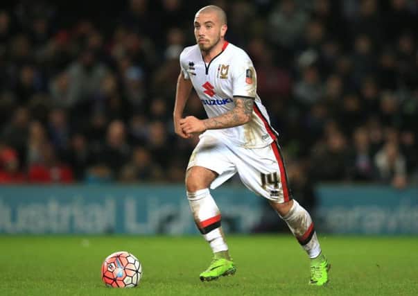 Sheffield United's new signing Samir Carruthers, in former club MK Dons' colours.