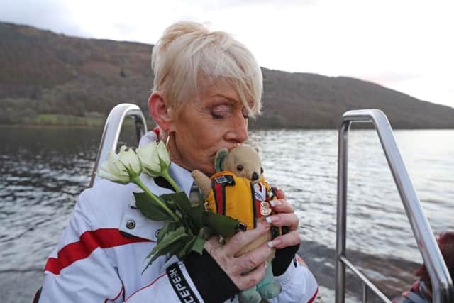 Gina Campbell, the daughter of world land and water speed record holder Donald Campbell, marks the 50th anniversary of the fatal crash there of his jet-powered Bluebird boat at Coniston.