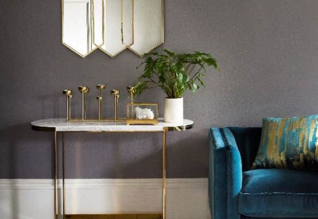 Gold and velvet are fashionable and opulent. This gold console table is Â£599 from Marks and Spencer