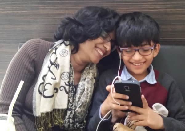 Ramya Kumar and her son Rishi, who has autism and a related learning disability.