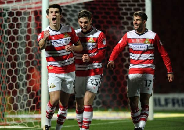 John Marquis bellows with delight after scoring the first of his brace of goals as League Two leaders Doncaster Rovers beat Portsmouth 3-1 last night (Picture: Jonathan Gawthorpe).