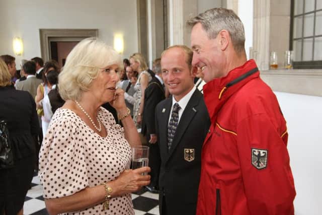 The Duchess of Cornwall meets German rider Michael Jung (centre) and Germany Coach Chris Bartle (right) at a reception for competitors, owners and sponsors at the first day of the Greenwich Park Eventing Invitational CIC2, at the Queen's House, in Greenwich, London.