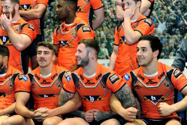 Zak Hardaker joins arms with team-mates Greg Minikin and Tom Holmes, during the Castleford Tigers photocall on Friday. Picture: Jonathan Gawthorpe