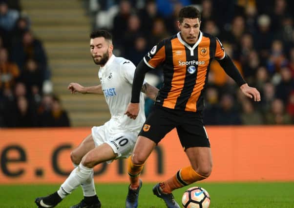 Hull City's Jake Livermore (right) and Swansea City's Borja Baston in action