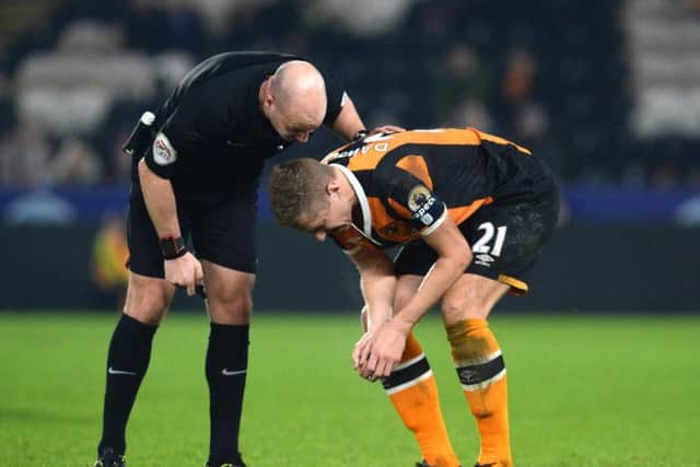 Michael Dawson gave Hull City fans a worry ahead of next week's EFL Cup clash with Manchester United after limping off  (Photo: PA)
