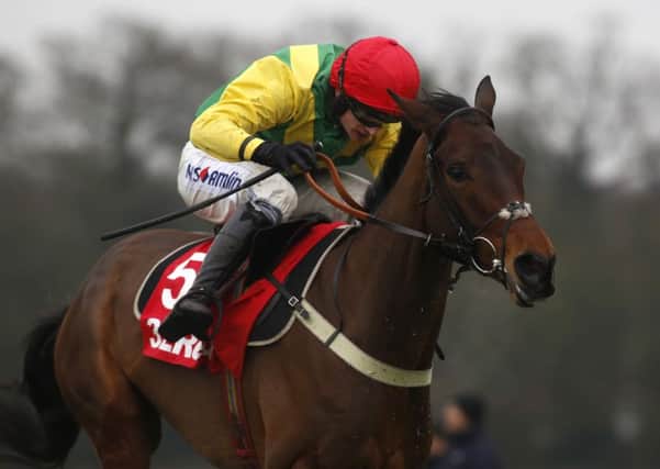 Finian's Oscar ridden by Tom O' Brien clears the last flight before going on to win The 32Red Tolworth Hurdle Race run during 32Red Day at Sandown.