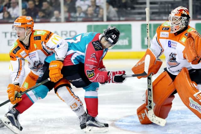 Belfast Giants' Adam Keefe tangles with Sheffield Steelers' Davey Phillips, left and Ervins Mustukovs during Saturday's clash at the SSE Arena. Picture courtesy of William Cherry/Presseye/EIHL.