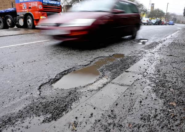 Should more money be spent repairing potholes?