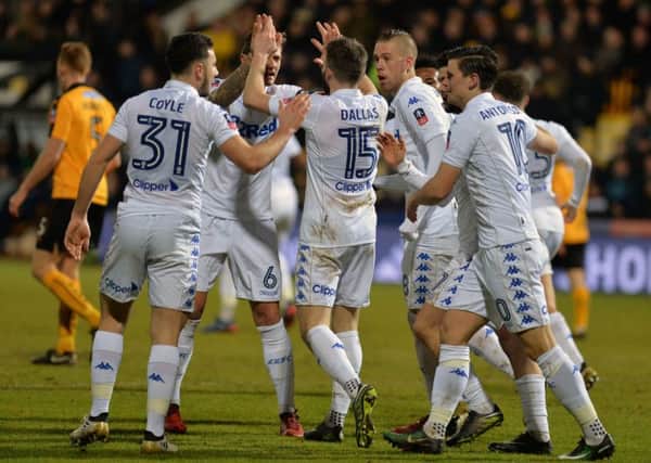 Stuart Dallas is congratulated by team-mates after equalising for Leeds United against League Two Cambridge United in their FA Cup third round tie (Picture: Bruce Rollinson).