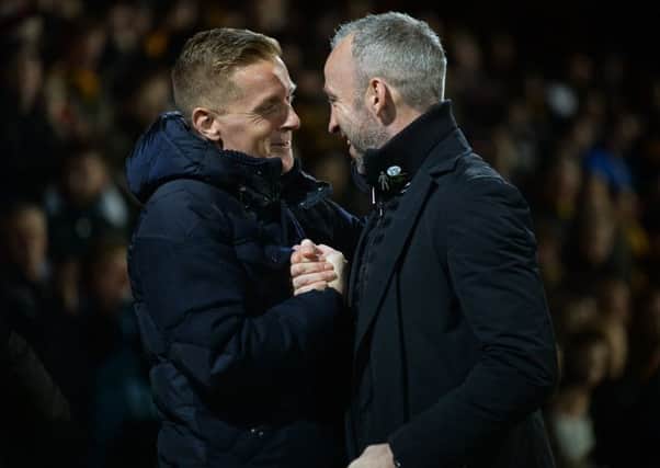 MAY THE BEST MAN WIN: Leeds United boss Garry Monk and Cambridge's Sean Derry have a quick chat before kick-off on Monday night.  Picture: Bruce Rollinson