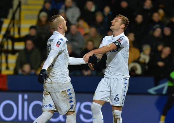 Pontus Jansson celebrates Leeds's winning goal at Cambridge United with Liam Cooper.
 Picture: Bruce Rollinson.