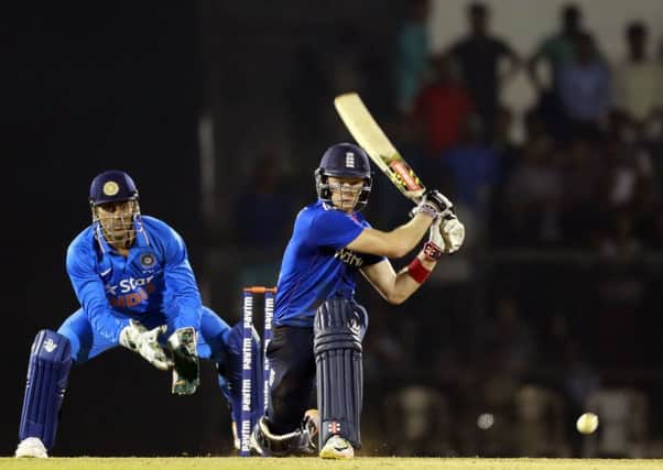 Englands Sam Billings reverse sweeps against India A during the tourists warm-up match in Mumbai (Picture: Rajanish Kakade/AP).