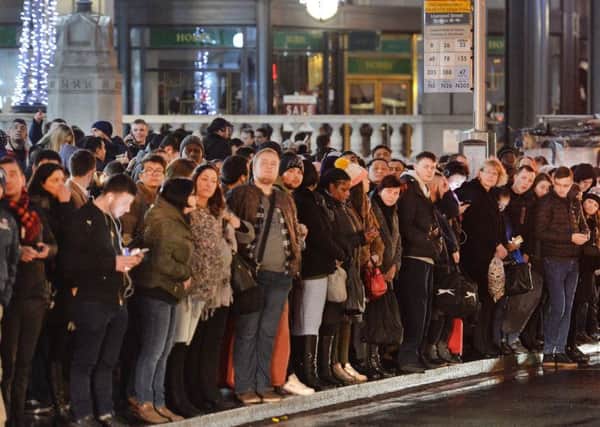 frustration: Long queues of people waiting for buses in London following this weeks uses Tube strike. (PA).