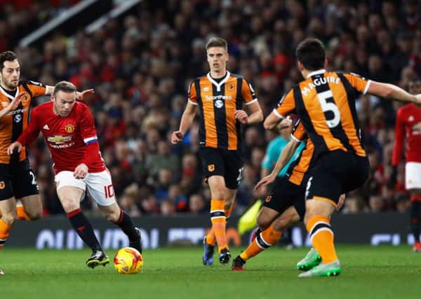 Manchester United's Wayne Rooney attempts a shot at goal at Old Trafford, against Hull City tonight Picture: Martin Rickett/PA