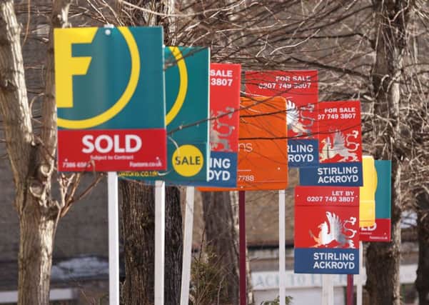 Estate agents for sale signs. Photo: Yui Mok/PA Wire