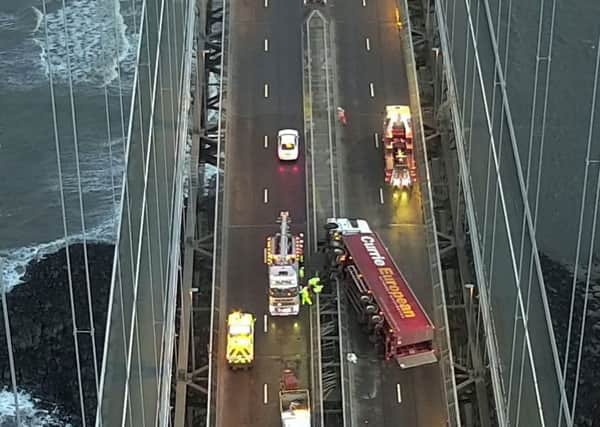 The Forth Road Bridge has been closed in both directions after a lorry was blown over in high winds. Picture: SWNS