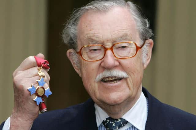 Alan Whicker receiving his MBE