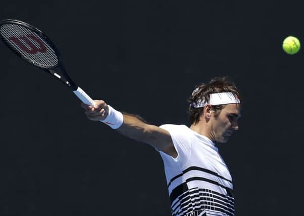 Switzerland's Roger Federer plays a backhand return during a practice session ahead of the Australian Open. (AP Photo/Mark Baker)