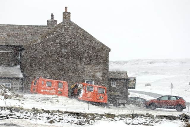 Snow falls at the Tan Hill Inn in North Yorkshire, as blizzard conditions are set to sweep in, bringing "a real taste of winter to the whole of the UK". PRESS ASSOCIATION Photo. Picture date: Thursday January 12, 2017. Frequent snow showers and strong winds are expected widely across Scotland, Northern Ireland, Wales and the north of England on Thursday with the possibility of sleet or snow for a short time in the south of the UK. See PA story WEATHER Snow. Photo credit should read: Owen Humphreys/PA Wire