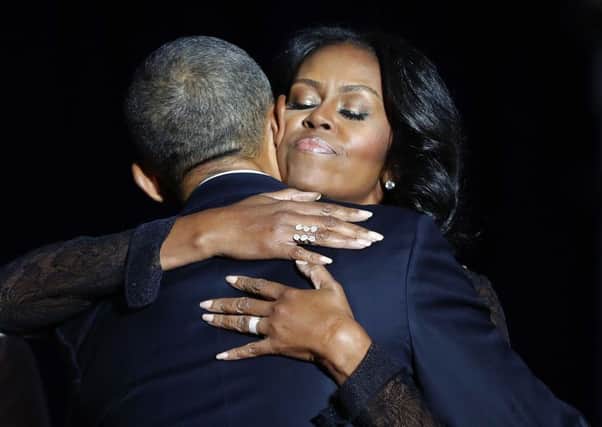 First lady Michelle Obama hugs President Barack Obama after his farewell address at McCormick Place in Chicago.