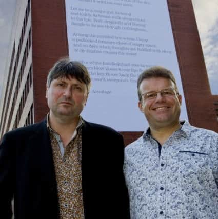 Simon Armitage and Professor Tony Ryan with the poem. Picture: Ross Parry Agency