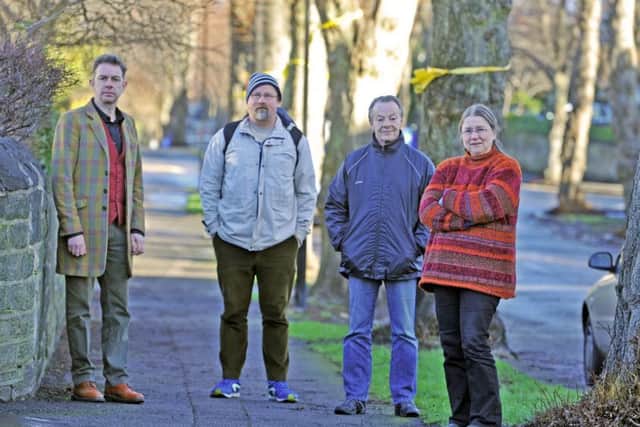13 January 2017 .......   Tree campaigner Helen McIlroy with fellow protestors Dr Simon Crump, Calvin Payne and Dave Dillner in Nether Edge in Sheffield. Picture Tony Johnson