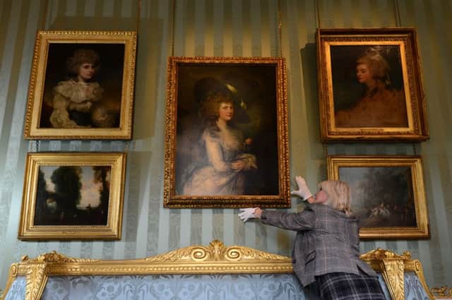 Open doors: Head guide Shenagh Firth at Chatsworth with a portrait of Duchess Georgiana
