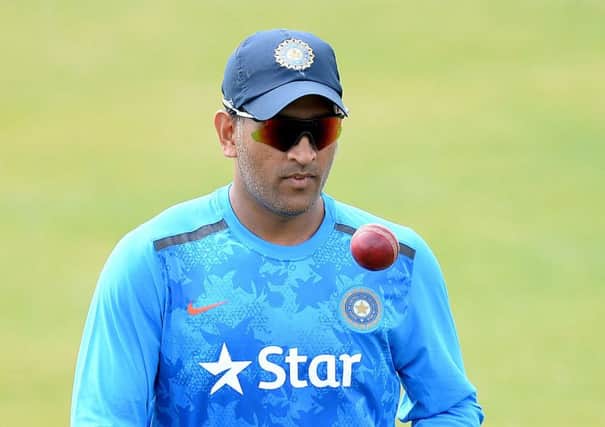 HOLDING BACK: India's MS Dhoni. Picture: Martin Rickett/PA.