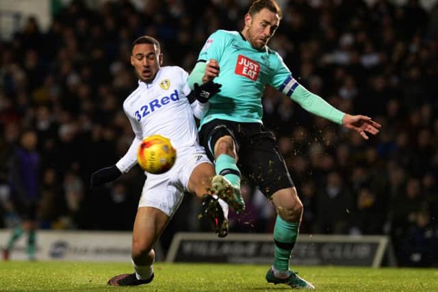 Kemar Roofe and Richard Keogh challenge for the ball at Elland Road. Picture: Bruce Rollinson