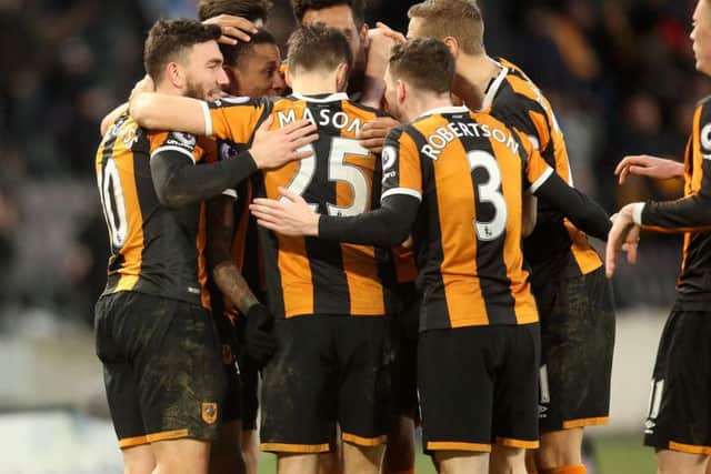 Hull City players celebrate their third goal (Photo: PA)