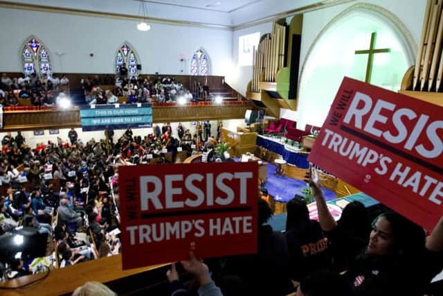 Immigrant rights advocates demonstrate against President-elect Donald Trump's immigration policies, during a rally at Metropolitan AME Church in Washington over the weekend.