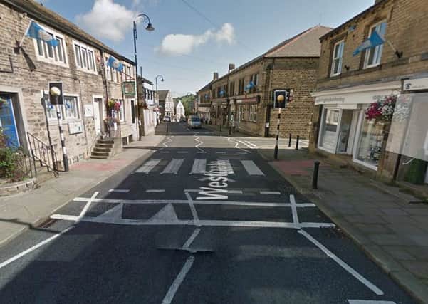 An 82-year-old woman was injured in the collision which occurred on Westgate in Honley.