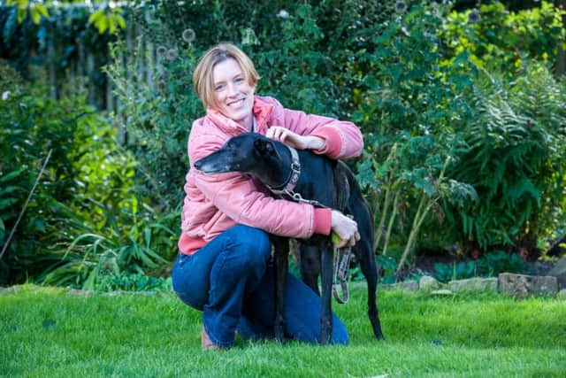 Family doctor and healthy living author Dr Julie Coffey walking her faithful Greyhound in Sheffield