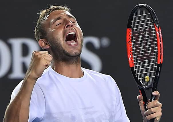 Britain's Daniel Evans celebrates after defeating Croatia's Marin Cilic in their second round match at the Australian Open tennis championships. Picture: AP/Andy Brownbill.