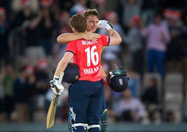 England's Jos Buttler (right) and captain Eoin Morgan celebrate  victory over Sri Lanka at the Ageas Bowl last July. Picture: Chris Ison/PA