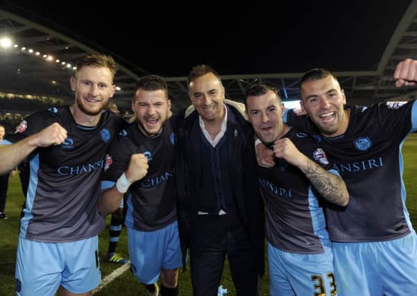 Carlos Carvalhal celebrates with his Owls players after last season's play-off semi-final victory at Brighton.