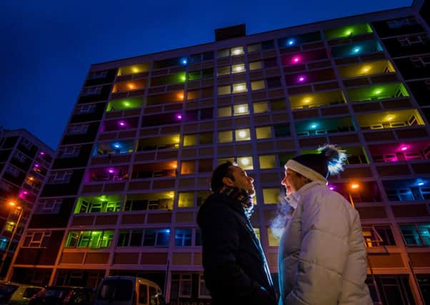 Artist Silvio Palladino, with resident Sharon Varney, looking at the major light art installation on a couple of high rise blocks 1 & 2, Melville Street, Hull: Picture James Hardisty