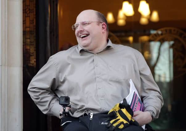 Doug Paulley, from Wetherby, West Yorkshire, outside the Supreme Court in London, after disabled travellers won a partial victory at the court in their battle for priority use of wheelchair spaces on buses. PRESS ASSOCIATION Photo.