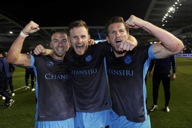 Ross Wallace, Tom Lees, Sam Hutchinson celebrate the Owls victory in the play-offs at Brighton last season.