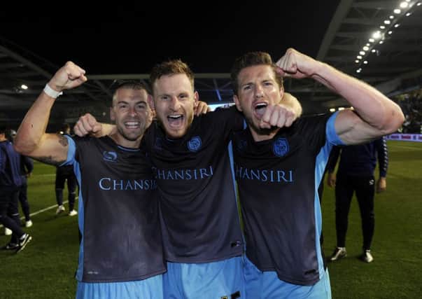 Ross Wallace, Tom Lees, Sam Hutchinson celebrate the Owls victory in the play-offs at Brighton last season.