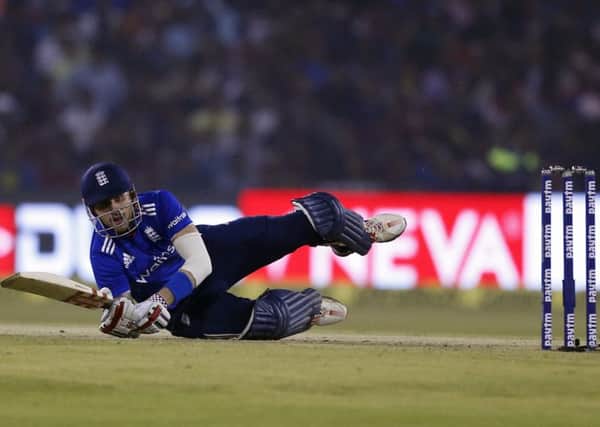 England's Alex Hales falls on the ground in Thursday's ODI defeat against India in Cuttack. Picture: AP/Aijaz Rahi