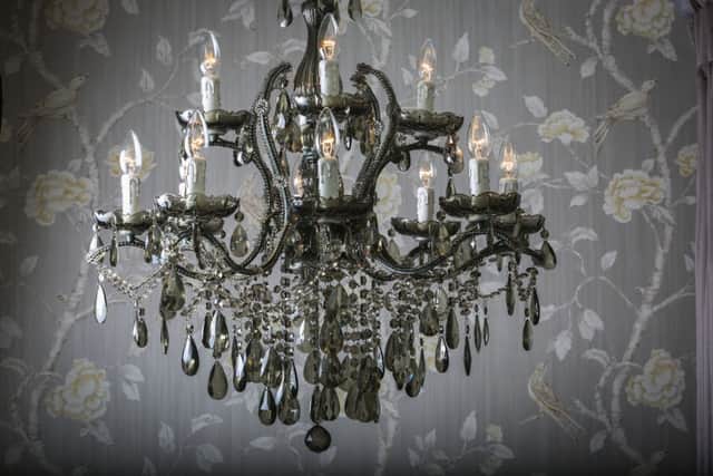 A chandelier reflects the grandeur of the space.
