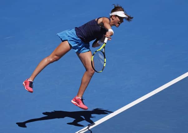 Britain's Johanna Konta serves to Japan's Naomi Osaka on her way to a second round victory at the Australian Open Picture: AP/Kin Cheung