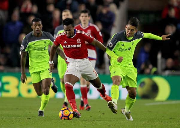Middlesbrough's Adama Traore battles for the ball with Liverpool's Georginio Wijnaldum (left). Picture: Richard Sellers/PA