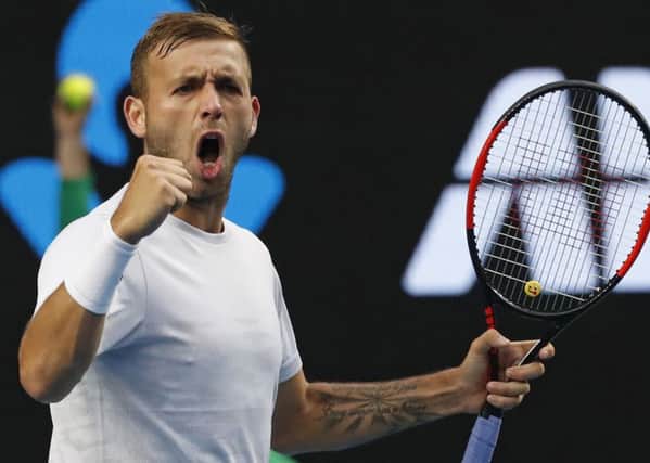 GET IN: Britain's Daniel Evans celebrates a point win over Australia's Bernard Tomic during their third round match at the Australian Open in MelbourneAP/Kin Cheung